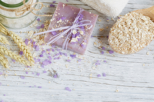 Natural handmade soap, sea salt, towel, oat flakes and wheat ear - Zdjęcie, obraz