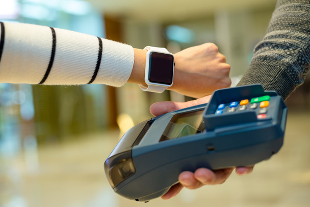 Woman paying the bill by smart watch  - Foto, Imagem
