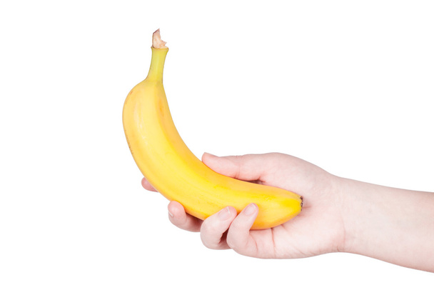 γυναικείο χέρι που κρατά μια μπανάνα - Φωτογραφία, εικόνα