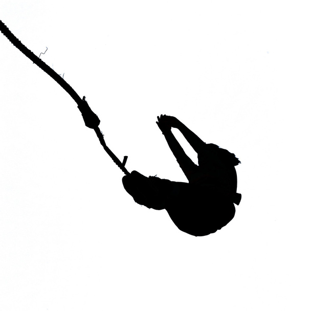 Schwarze Silhouette eines Bungee-Jumpers auf Weiß - Foto, Bild