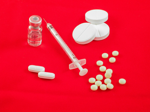 Pills, drugs caplets and syringe - Photo, Image