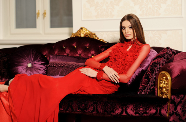 alluring woman relaxing on a sofa in luxury interior - Foto, immagini