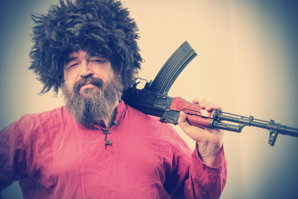 bearded man with gun - Foto, imagen