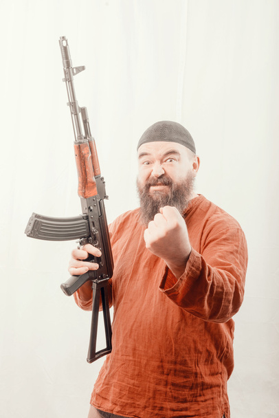 bearded man with gun - Фото, зображення