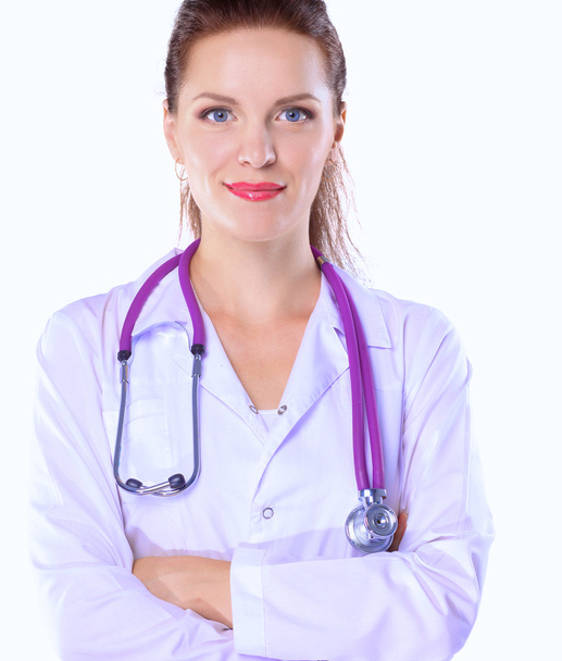 Portrait of young woman doctor with white coat standing in hospital - Foto, imagen
