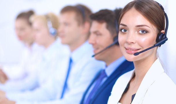 Attractive Smiling positive young businesspeople and colleagues in a call center office - Photo, Image