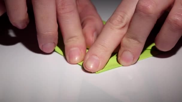 Hands making origami. Closeup - Footage, Video