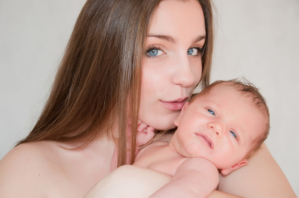 Picture of happy young mother with newborn baby - Fotoğraf, Görsel