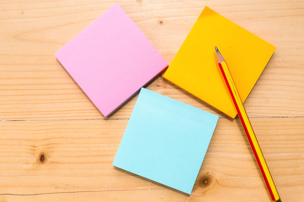 colorful sticky notes with pencil on wooden table background. - Photo, Image