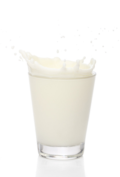 Milk splah on a glass, over white background - Photo, Image