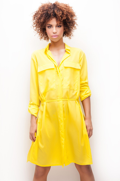 Girl with afro in yellow dress. - Фото, зображення