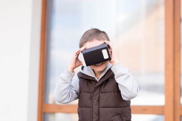 little boy using VR virtual reality goggles - Photo, Image