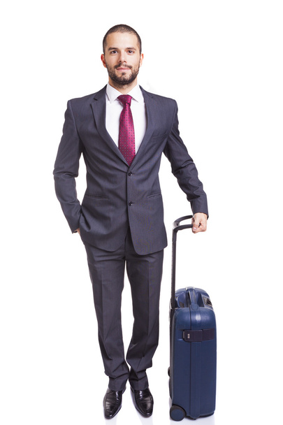 Business man standing with suitcase - Foto, imagen