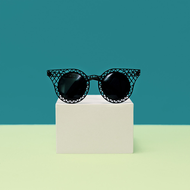Black stylish Sunglasses on bright background. Minimalism fashio - Foto, imagen