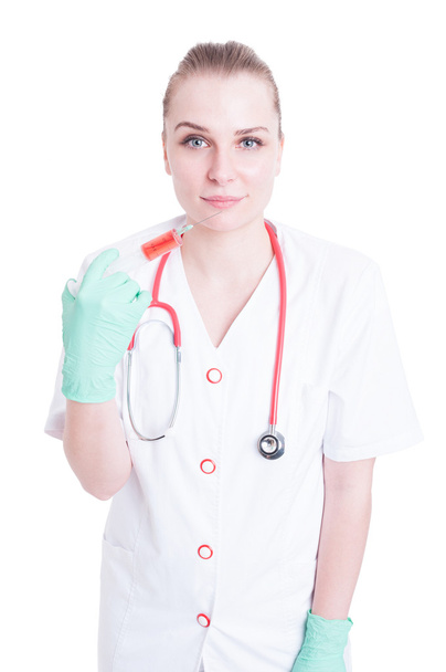 Healthcare and medicine concept with young doctor holding a syri - Foto, Imagen
