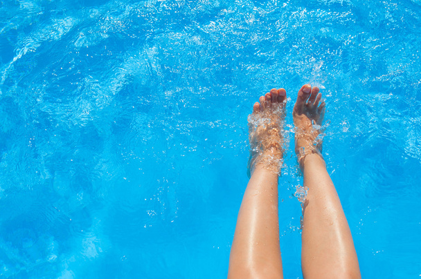 female legs in blue water pool - Photo, Image