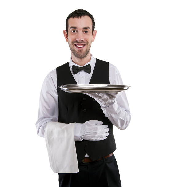 Waiter holding tray. Isolated over white background. Smiling but - Photo, Image