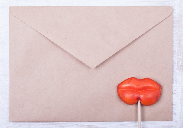 love letter background. envelope and candy in form female lips - Photo, Image