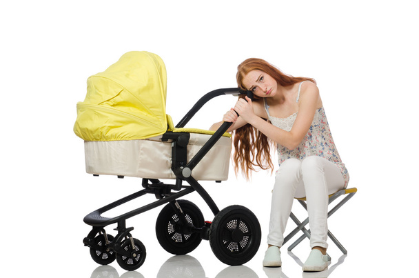 Женщина с ребенком и коляской изолированы на белом - Фото, изображение