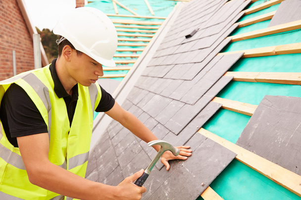 Construction Worker Laying Slate Tiles - Foto, Imagen