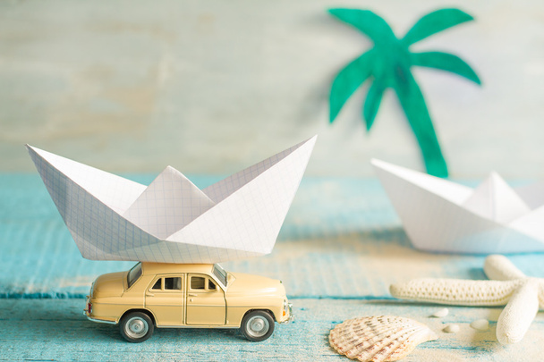 Holiday vacation concept with abstract origami boat and tropical beach - Zdjęcie, obraz