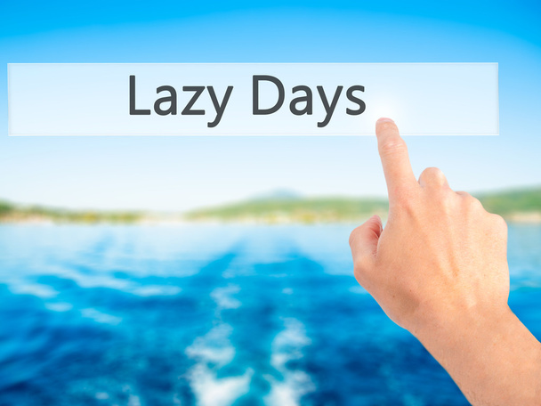 Lazy Days - ruky stisknutí tlačítka na rozmazané pozadí konceptu - Fotografie, Obrázek