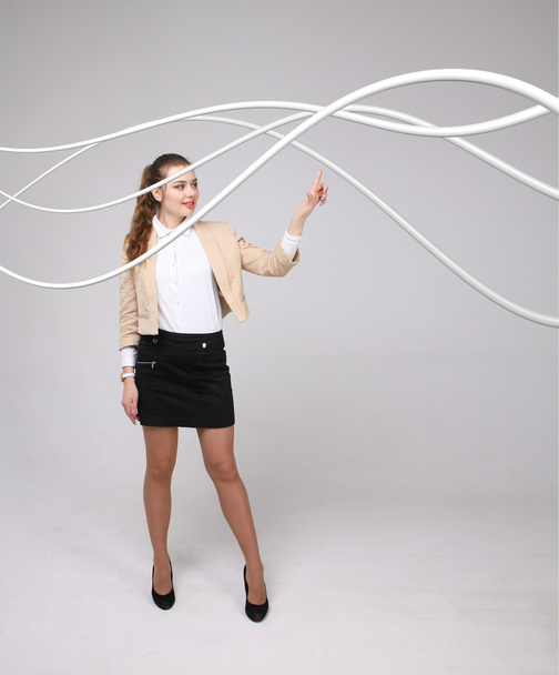Woman with electrical cables or wires, curved lines - Foto, Bild