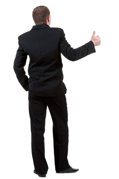 Back view of business man thumbs up - Фото, изображение