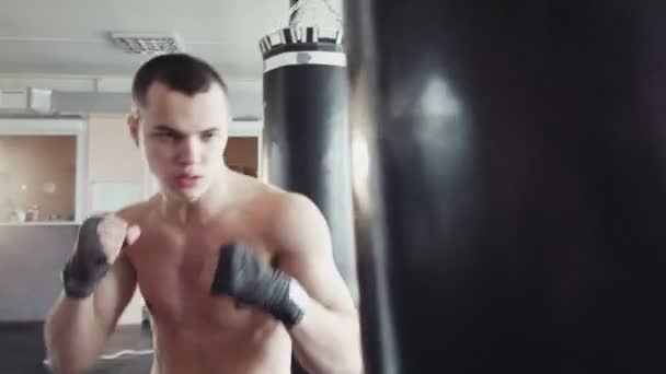 Boxer hitting the punching bag - Footage, Video