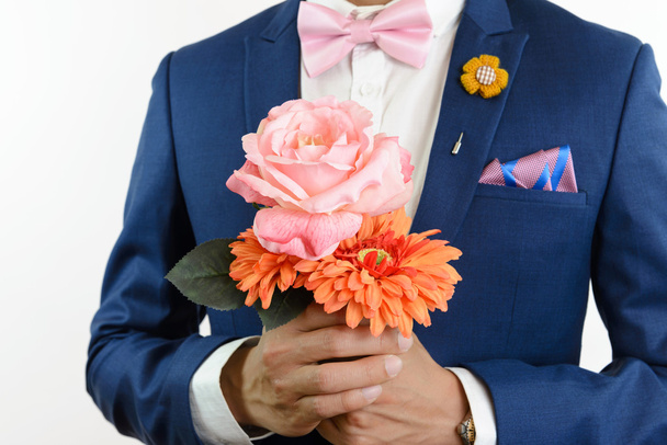 man in blue suit carry flowers - Photo, image