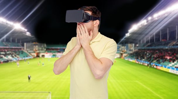 man in virtual reality headset over football field - Zdjęcie, obraz
