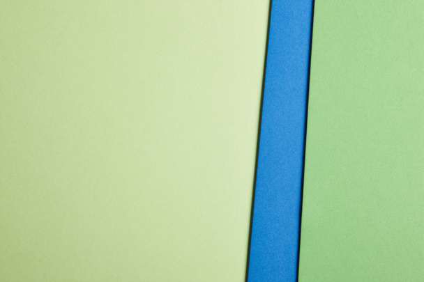 Colored cardboards background in green blue tone. Copy space - Фото, изображение