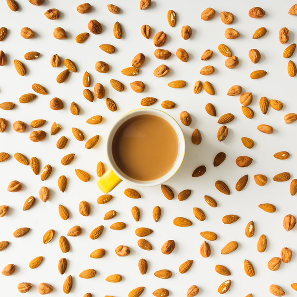 Almonds with coffee cup. - Photo, Image