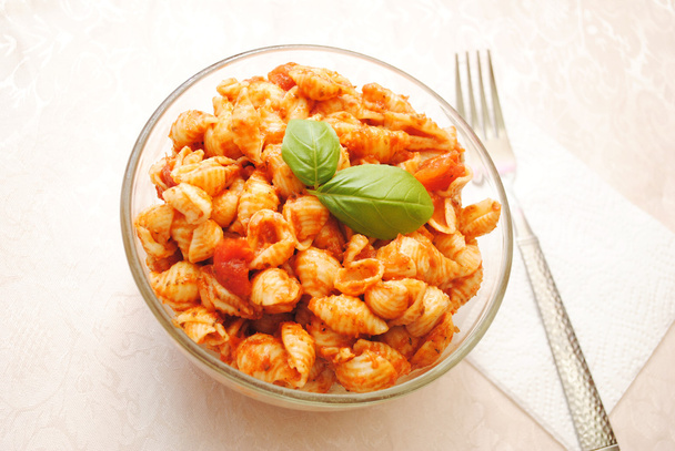 A Glass Bowl Filled with Shell Pasta with Tomato Sauce - Photo, Image