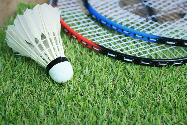 Shuttlecocks with badminton racket - Фото, изображение