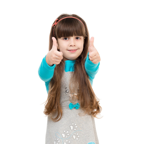 little schoolgirl with thumbs up - Foto, Imagen