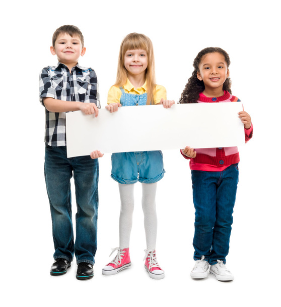 three children with open mouths holding empty sheet of paper - Φωτογραφία, εικόνα