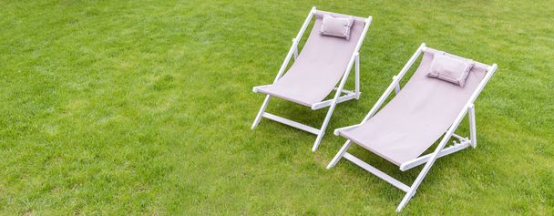Deck chairs in the garden - Фото, изображение