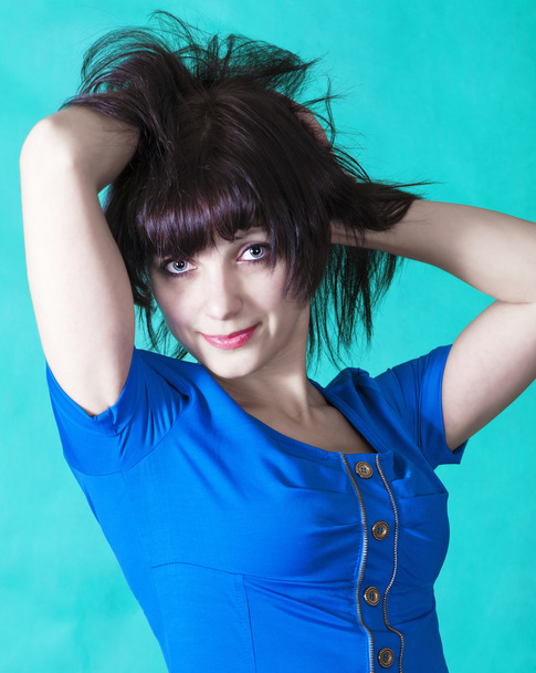 Beautiful brunette in a blue dress - Valokuva, kuva