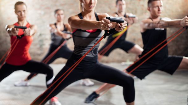 Exercise class with stretching band - Foto, afbeelding