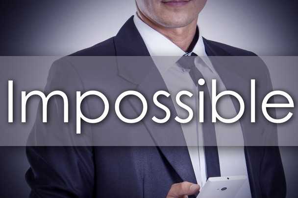 Impossible - Young businessman with text - business concept - Zdjęcie, obraz