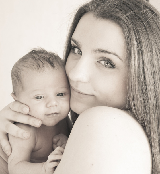Picture of happy young mother with newborn baby - Valokuva, kuva