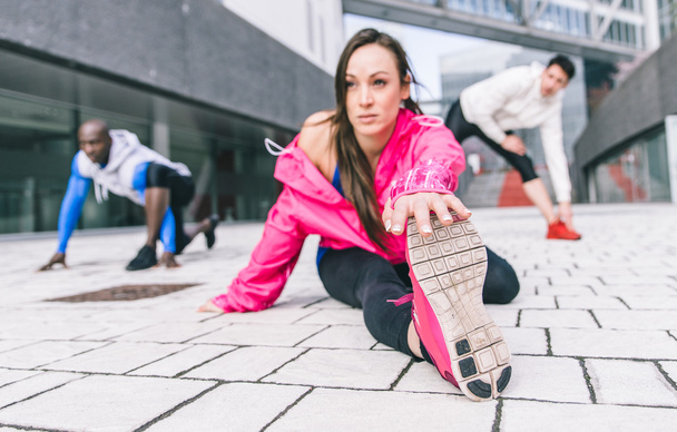 Group of urban runners making sport in an urban area - Фото, изображение