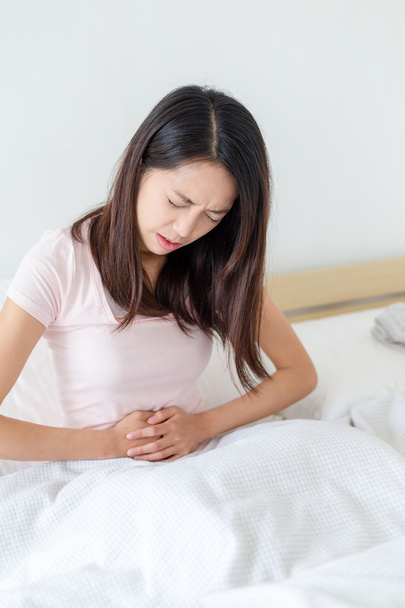 woman getting stomach pain - 写真・画像