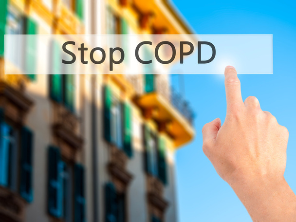 Stop COPD - Käsi painamalla painiketta hämärtynyt tausta käsite
 - Valokuva, kuva