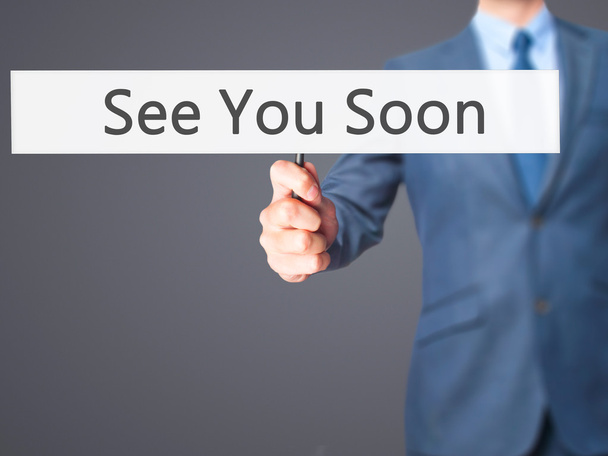 See You Soon - Businessman hand holding sign - Photo, Image