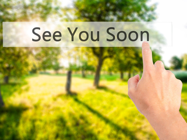 See You Soon - Hand pressing a button on blurred background conc - Photo, Image