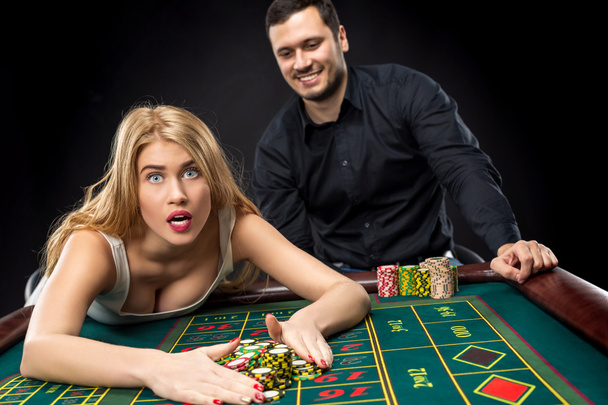 Couple playing roulette wins at the casino. - Photo, Image