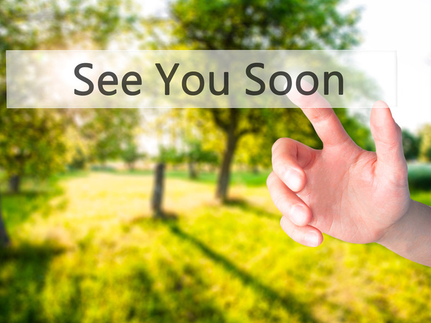 See You Soon - Hand pressing a button on blurred background conc - Photo, Image