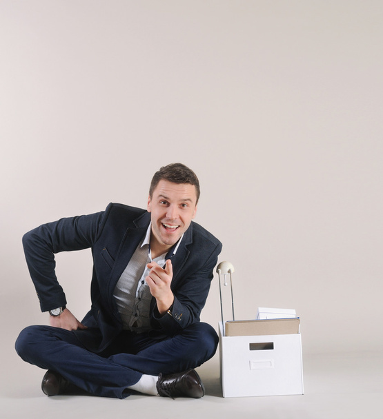 studio shot of attractive positive businessman with office stuff - Photo, Image